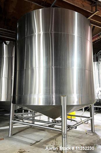 Used JV Northwest 10,000 Gallon Stainless Steel Tank with cone bottom. Vessel measures 12' diameter x 11-1/2 straight side with cone bottom leading to 4" diameter center bottom outlet with manual val...