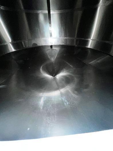 Used JV Northwest 10,000 Gallon Stainless Steel Tank with cone bottom. Vessel measures 12' diameter x 11-1/2 straight side with cone bottom leading to 4" diameter center bottom outlet with manual val...