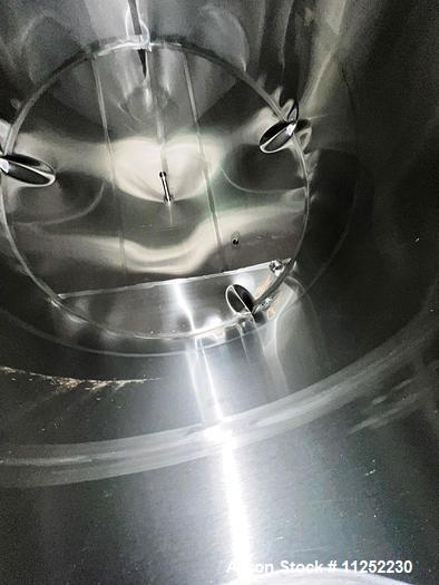Used JV Northwest 10,000 Gallon Stainless Steel Tank with cone bottom. Vessel measures 12' diameter x 11-1/2 straight side with cone bottom leading to 4" diameter center bottom outlet with manual val...