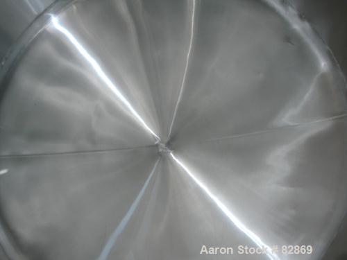 Used Chester Jensen Tank, 5,000 gallon, Model AHC, 304 stainless steel, horizontal. 114" diameter x 98" straight side, dished heads. Bottom of tank dimple jacketed, approximately 6' wide x 8' long ar...