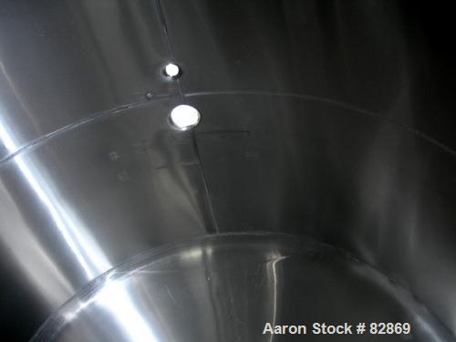 Used Chester Jensen Tank, 5,000 gallon, Model AHC, 304 stainless steel, horizontal. 114" diameter x 98" straight side, dished heads. Bottom of tank dimple jacketed, approximately 6' wide x 8' long ar...