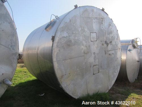 Used Krenz Approximately 8,500 Gallon Stainless Steel Storage Tank. Approximately 11' diameter x 12' straight side. Flat bottom and slight cone top. Various top openings including a 17"manway with co...