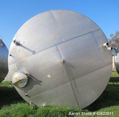 Used Krenz Approximately 8,500 Gallon Stainless Steel Storage Tank. Approximately 11' diameter x 12' straight side. Flat bottom and slight cone top. Various top openings including a 17" manway with c...