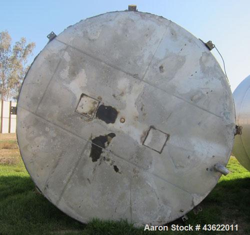 Used Krenz Approximately 8,500 Gallon Stainless Steel Storage Tank. Approximately 11' diameter x 12' straight side. Flat bottom and slight cone top. Various top openings including a 17" manway with c...