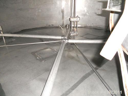 Used Krenz Approximately 8,500 Gallon Stainless Steel Storage Tank. Approximately 11' diameter x 12' straight side. Flat bottom and slight cone top. Various top openings including a 17" manway with c...