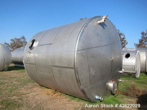 Used Saracco Tank & Mfg Approximately 8,500 Gallon Stainless Steel Storage Tank. Approximately 11' diameter x 12' straight side. Flat bottom and slight cone top. Various top openings including a 17"m...