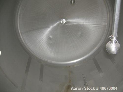 Used L'Hoir Incorporated tank, 4803 gallons (4000 Imperial), 304 stainless steel, horizontal. Approximately 94 1/2" diameter x 144" straight side, dished heads. 2 internal CIP spray balls. Top Openin...