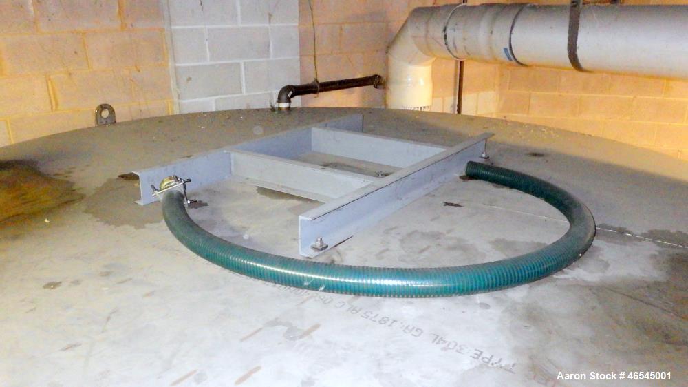 Used Lewis Metals Corp Tank, 7684 Gallon, 304 Stainless Steel, Vertical.  114" Dia. x 174" Straight Side, Flat Top and Flat Bottom, 24" Side Bottom Manway with Cover.  Built in 2001.
