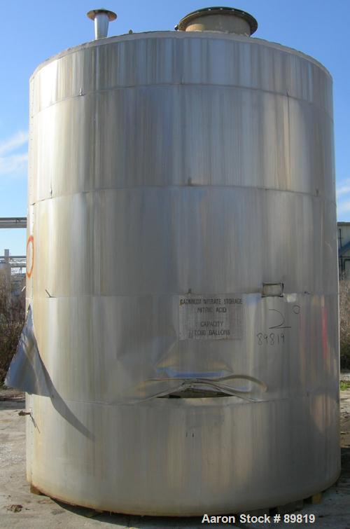 USED: Metal Equipment tank, approximately 7,000 gallons, stainless steel. Insulated. 10' diameter x 12' straight side. Flat bottom, dish top.