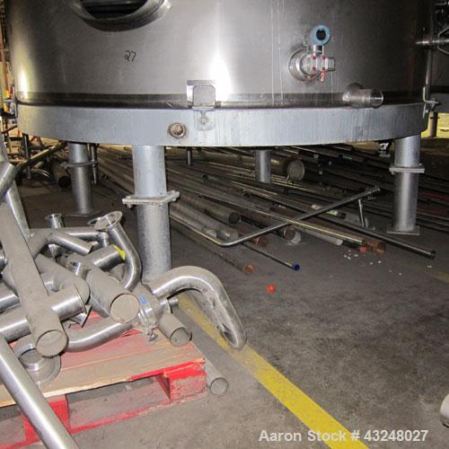 Used Mueller Tank, 6000 Gallon, Model DF, 304 Stainless Steel, Vertical. Approximate 118" diameter x 126" straight side. Off center coned top, sloped bottom. (1) 46” Section of dimple jacket on the s...