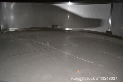 Used Mueller Tank, 6000 Gallon, Model DF, 304 Stainless Steel, Vertical. Approximate 118" diameter x 126" straight side. Off center coned top, sloped bottom. (1) 46” Section of dimple jacket on the s...