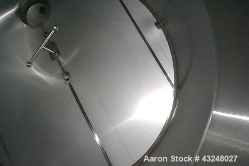 Used Mueller Tank, 6000 Gallon, Model DF, 304 Stainless Steel, Vertical. Approximate 118" diameter x 126" straight side. Off center coned top, sloped bottom. (1) 46” Section of dimple jacket on the s...