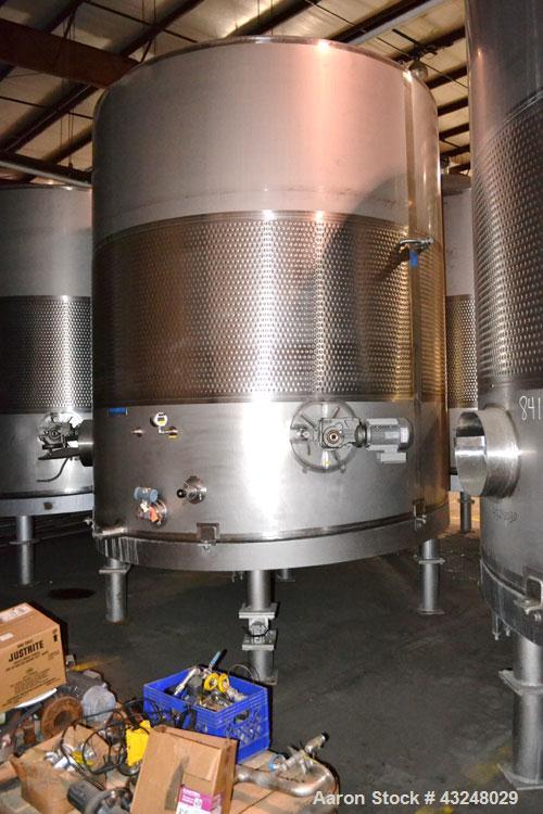 Used Mueller Tank, 6000 Gallon, Model DF, 304 Stainless Steel, Vertical. Approximate 118" diameter x 126" straight side. Off center coned top, sloped bottom. (1) 46” Section of dimple jacket on the s...