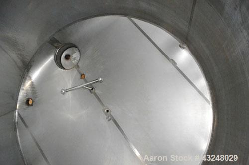 Used Mueller Tank, 6000 Gallon, Model DF, 304 Stainless Steel, Vertical. Approximate 118" diameter x 126" straight side. Off center coned top, sloped bottom. (1) 46” Section of dimple jacket on the s...