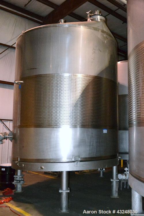 Used Mueller Tank, 6000 Gallon, Model DF, 304 Stainless Steel, Vertical. Approximate 118" diameter x 126" straight side. Off center coned top, sloped bottom. (1) 46” Section of dimple jacket on the s...