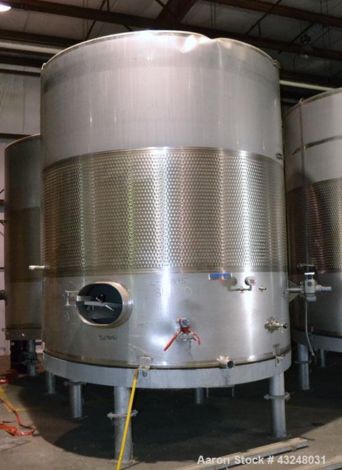 Used Mueller Tank, 6000 Gallon, Model DF, 304 Stainless Steel, Vertical. Approximate 118" diameter x 126" straight side. Off center coned top, sloped bottom. (1) 46” Section of dimple jacket on the s...