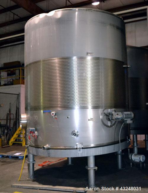 Used Mueller Tank, 6000 Gallon, Model DF, 304 Stainless Steel, Vertical. Approximate 118" diameter x 126" straight side. Off center coned top, sloped bottom. (1) 46” Section of dimple jacket on the s...