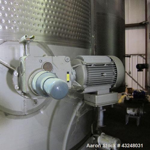 Used Mueller Tank, 6000 Gallon, Model DF, 304 Stainless Steel, Vertical. Approximate 118" diameter x 126" straight side. Off center coned top, sloped bottom. (1) 46” Section of dimple jacket on the s...