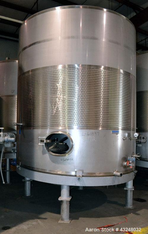 Used Mueller Tank, 6000 Gallon, Model DF, 304 Stainless Steel, Vertical. Approximate 118" diameter x 126" straight side. Off center coned top, sloped bottom. (1) 46” Section of dimple jacket on the s...