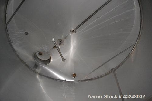 Used Mueller Tank, 6000 Gallon, Model DF, 304 Stainless Steel, Vertical. Approximate 118" diameter x 126" straight side. Off center coned top, sloped bottom. (1) 46” Section of dimple jacket on the s...