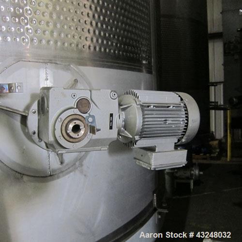 Used Mueller Tank, 6000 Gallon, Model DF, 304 Stainless Steel, Vertical. Approximate 118" diameter x 126" straight side. Off center coned top, sloped bottom. (1) 46” Section of dimple jacket on the s...