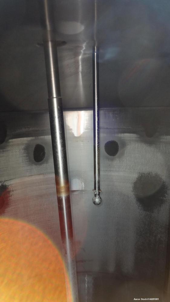 Used Mueller Storage Tank, 6,000 Gallon, Model D, 304 Stainless Steel, Vertical. 112” Diameter x approximate 135” straight side, dished top, 5” pitched sloped bottom. sidewall dimple jacket, approxim...