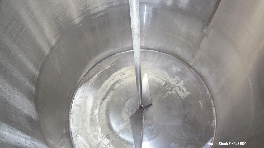 Used Mueller Storage Tank, 6,000 Gallon, Model D, 304 Stainless Steel, Vertical. 112” Diameter x approximate 135” straight side, dished top, 5” pitched sloped bottom. sidewall dimple jacket, approxim...