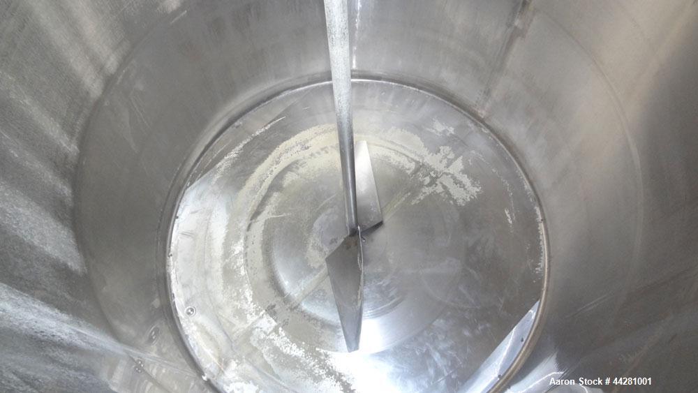 Used Mueller Storage Tank, 6,000 Gallon, Model D, 304 Stainless Steel, Vertical. 112” Diameter x approximate 135” straight side, dished top, 5” pitched sloped bottom. sidewall dimple jacket, approxim...