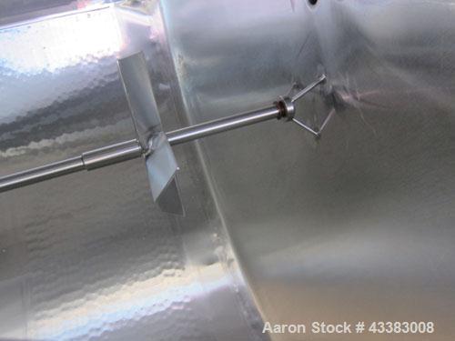 Used Mueller Tank, 5,000 Gallon, 304 Stainless Steel. Approximate 108” Diameter x approximate 125” straight side, dished top and bottom. 20 Cubic feet partial section of sidewall dimple jacket, cooli...