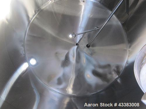 Used Mueller Tank, 5,000 Gallon, 304 Stainless Steel. Approximate 108” Diameter x approximate 125” straight side, dished top and bottom. 20 Cubic feet partial section of sidewall dimple jacket, cooli...