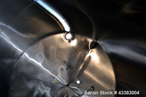 Used Mueller Tank, 5,000 Gallon, 304 Stainless Steel. Approximate 108” Diameter x approximate 125” straight side, dished top and bottom. Partial section of sidewall dimple jacket, no rating. Off cent...