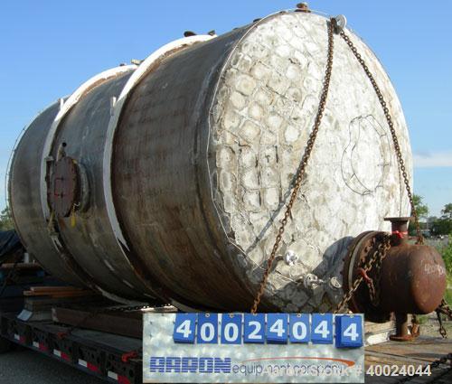 Used Tank, 6000 Gallon, 317 Stainless Steel, Horizontal. Approximately 9' diameter x 12' long, dished ends. Top entering Lightnin agitator, model 118-REC-3.2, ratio 17.40 to 1, output 100/50 rpm. 2" ...