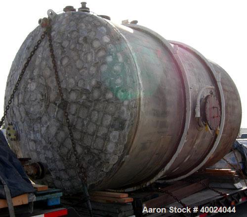 Used Tank, 6000 Gallon, 317 Stainless Steel, Horizontal. Approximately 9' diameter x 12' long, dished ends. Top entering Lightnin agitator, model 118-REC-3.2, ratio 17.40 to 1, output 100/50 rpm. 2" ...