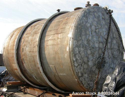Used Tank, 6000 Gallon, 317 Stainless Steel, Horizontal. Approximately 9' diameter x 12' long, dished ends. Top entering Lightnin agitator, model 118-REC-3.2, ratio 17.40 to 1, output 100/50 rpm. 2" ...