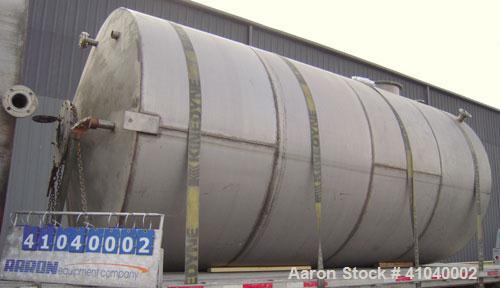 Used Tank, 6,000 Gallon, 304 Stainless Steel, Vertical.  Approximate 96" diameter x 192" straight side. Dish top, flat bottom.  Openings: top 20" bolt on manway with cover with 8" hinged door, 1/2" N...