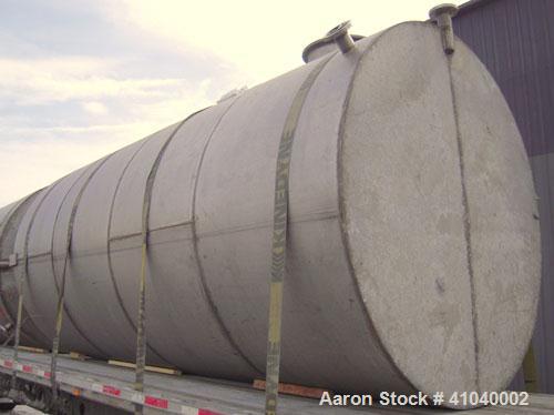 Used Tank, 6,000 Gallon, 304 Stainless Steel, Vertical.  Approximate 96" diameter x 192" straight side. Dish top, flat bottom.  Openings: top 20" bolt on manway with cover with 8" hinged door, 1/2" N...