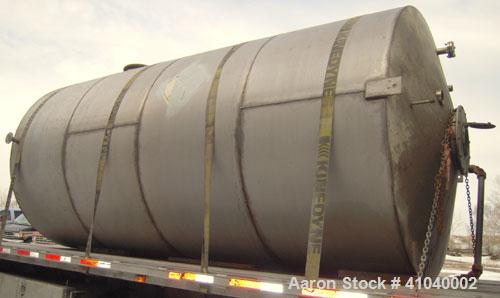 Used Tank, 6,000 Gallon, 304 Stainless Steel, Vertical.  Approximate 96" diameter x 192" straight side. Dish top, flat bottom.  Openings: top 20" bolt on manway with cover with 8" hinged door, 1/2" N...