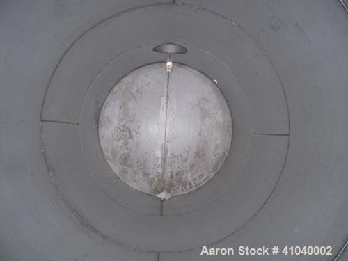 Used Tank, 6,000 Gallon, 304 Stainless Steel, Vertical.  Approximate 96" diameter x 192" straight side. Dish top, flat bottom.  Openings: top 20" bolt on manway with cover with 8" hinged door, 1/2" N...