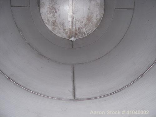 Used Tank, 6,000 Gallon, 304 Stainless Steel, Vertical.  Approximate 96" diameter x 192" straight side. Dish top, flat bottom.  Openings: top 20" bolt on manway with cover with 8" hinged door, 1/2" N...