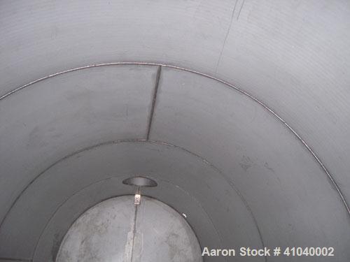 Used Tank, 6,000 Gallon, 304 Stainless Steel, Vertical.  Approximate 96" diameter x 192" straight side. Dish top, flat bottom.  Openings: top 20" bolt on manway with cover with 8" hinged door, 1/2" N...