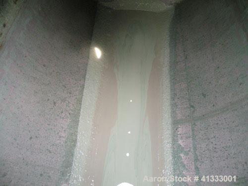 Used Florida Tank and Container Pressure Tank, 6000 gallon, 316L stainless steel, horizontal. 96" diameter x 180" straight side, dished heads. Internal rated 14.9 psi. Openings: top 20" manway with c...