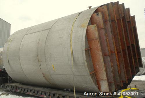 Used Tank, Approximate 17,000 Gallon, 316 Stainless Steel, Vertical. Approximate 144" diameter x 242" straight side, coned top (dented), sloped bottom. Top openings: (2) 3", 4", side 24" manway with ...