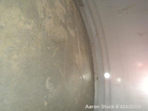 Used Tank, Approximately 5,000 Gallon / 19,220 Liter, 304 Stainless Steel, Vertical. 72" Diameter x 288" straight side, dish top and sloped bottom. Openings: top 18" manway with cover, 3" sanitary, 1...