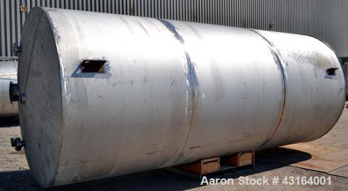 Used Tank, 5,700 Gallon, 304 Stainless Steel, Vertical.  Approximately 90’’ diameter x 210’’ straight side.  Coned top, flat bottom.  Openings: top (2) 3’’, 10’’, 4-1/2’’ NPT; side 3’’, 19’’ manway, ...