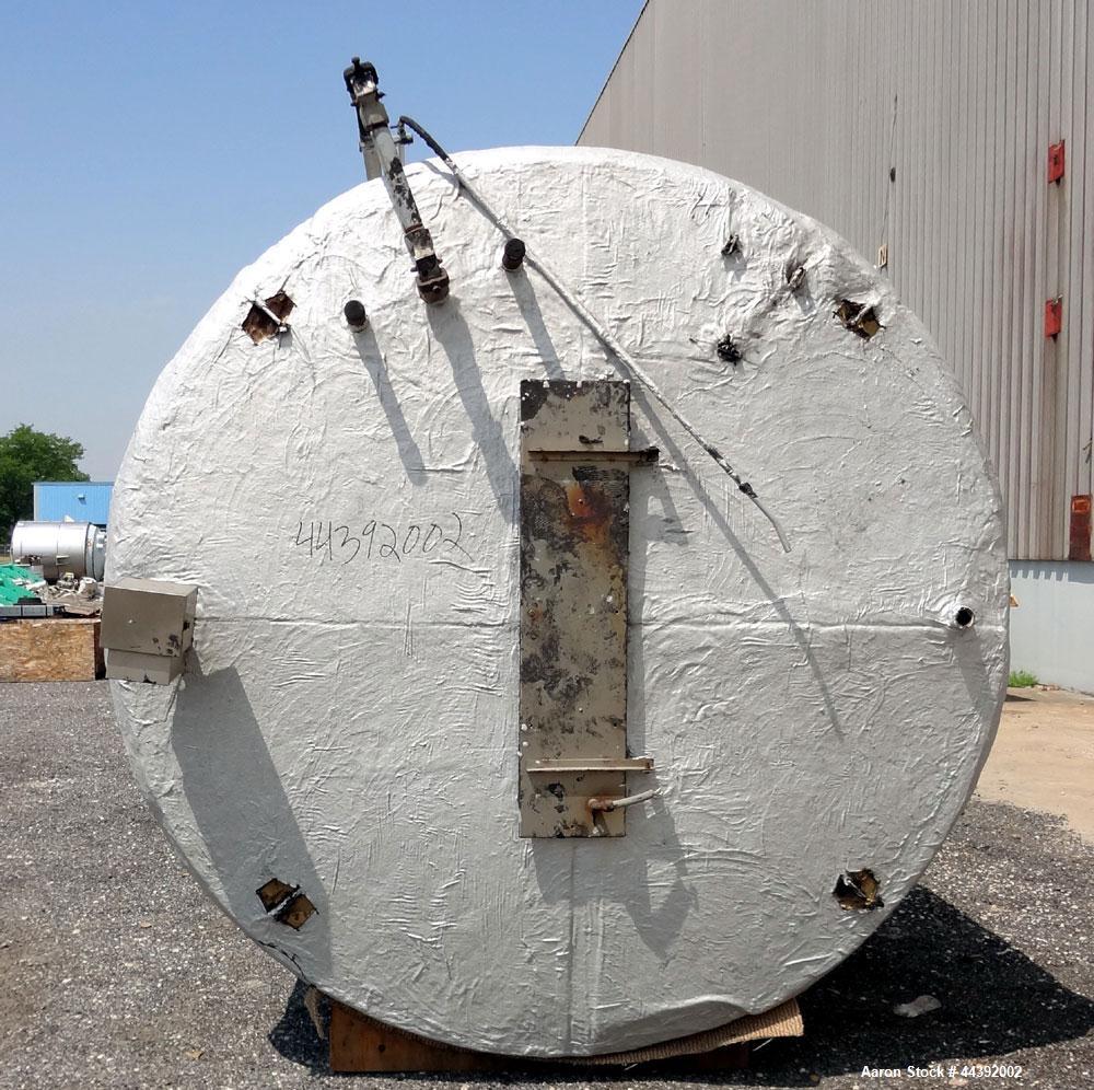 Used Tank, 5200 Gallon, 304 Stainless Steel, Vertical. Approximately 96" diameter x 170" straight side, flat top and bottom. Approximately 2" bottom head internal pipe coil. Openings: top 42" x 5" wi...