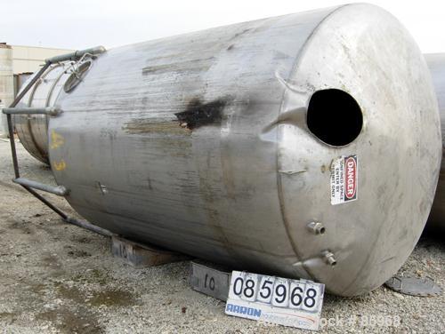 Used Tank, 5,000 Gallon, 304 Stainless Steel, Vertical. Approximate 102" diameter x 144" straight side. Dish top and bottom. Side bottom agitator, 3 blade prop, driven by a 5 HP, 3/60/230/460 Volt, 1...