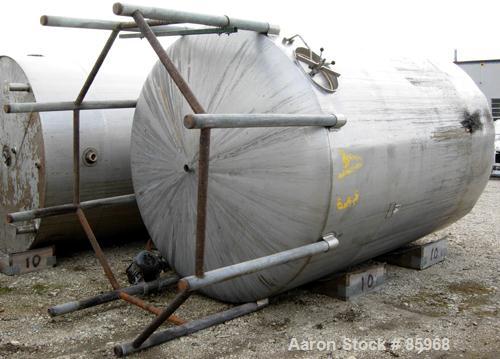 Used Tank, 5,000 Gallon, 304 Stainless Steel, Vertical. Approximate 102" diameter x 144" straight side. Dish top and bottom. Side bottom agitator, 3 blade prop, driven by a 5 HP, 3/60/230/460 Volt, 1...