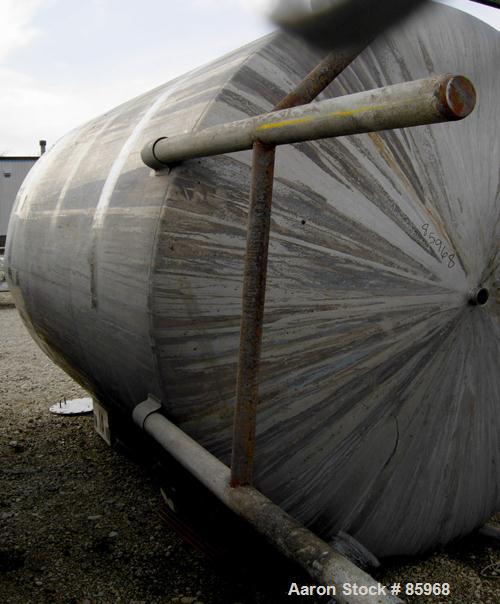Used Tank, 5,000 Gallon, 304 Stainless Steel, Vertical. Approximate 102" diameter x 144" straight side. Dish top and bottom. Side bottom agitator, 3 blade prop, driven by a 5 HP, 3/60/230/460 Volt, 1...