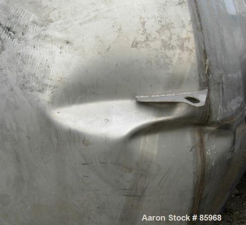 Used Tank, 5,000 Gallon, 304 Stainless Steel, Vertical. Approximate 102" diameter x 144" straight side. Dish top and bottom. Side bottom agitator, 3 blade prop, driven by a 5 HP, 3/60/230/460 Volt, 1...