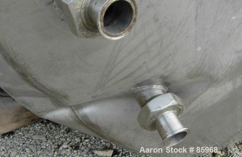 Used Tank, 5,000 Gallon, 304 Stainless Steel, Vertical. Approximate 102" diameter x 144" straight side. Dish top and bottom. Side bottom agitator, 3 blade prop, driven by a 5 HP, 3/60/230/460 Volt, 1...